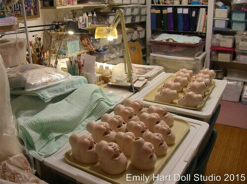 Trays of heads partly painted